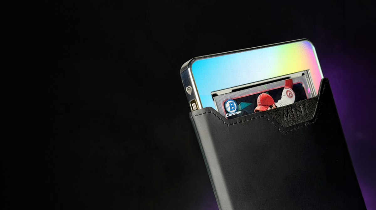 The M1NT Case G1 holding a graded baseball card, shown at an angle with a rainbow reflection across its face